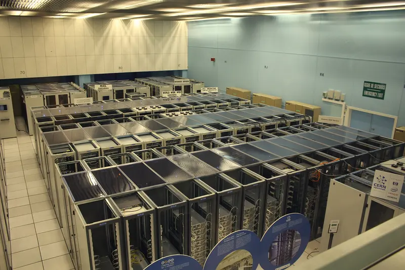 Rows of server racks in the CERN data centre, with signs marking the web and mail servers